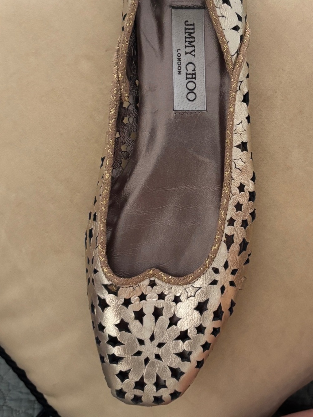 Gold leather Jimmy Choo square-toe flats with laser stars